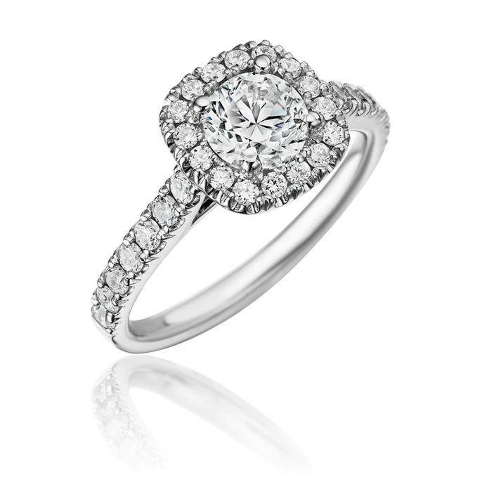 A diamond halo engagement ring in white gold.
