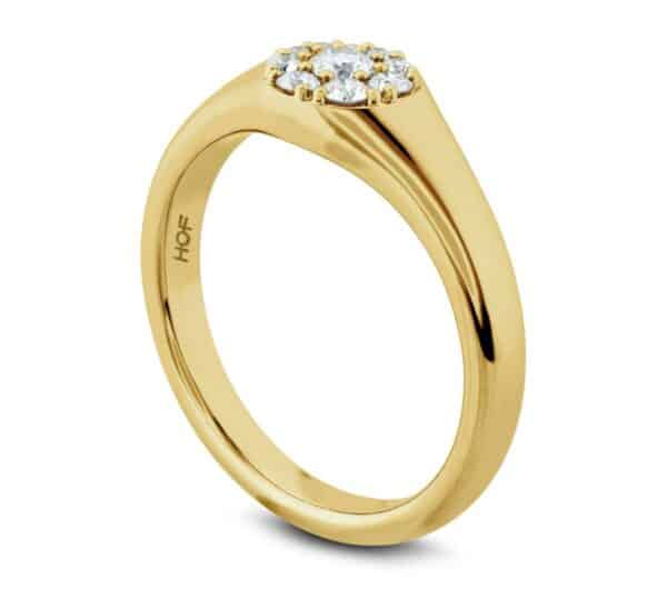 A yellow gold ring with a cluster of diamonds.