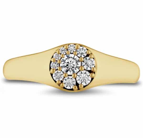 A yellow gold ring with a cluster of diamonds.