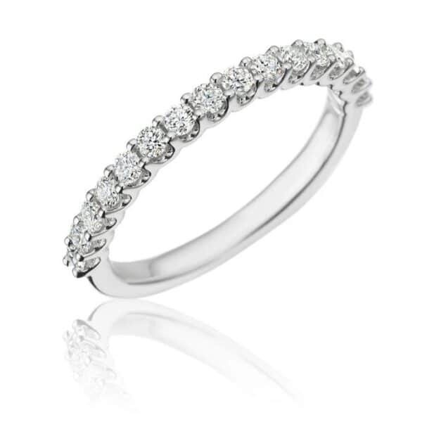 A white gold wedding band with round diamonds.