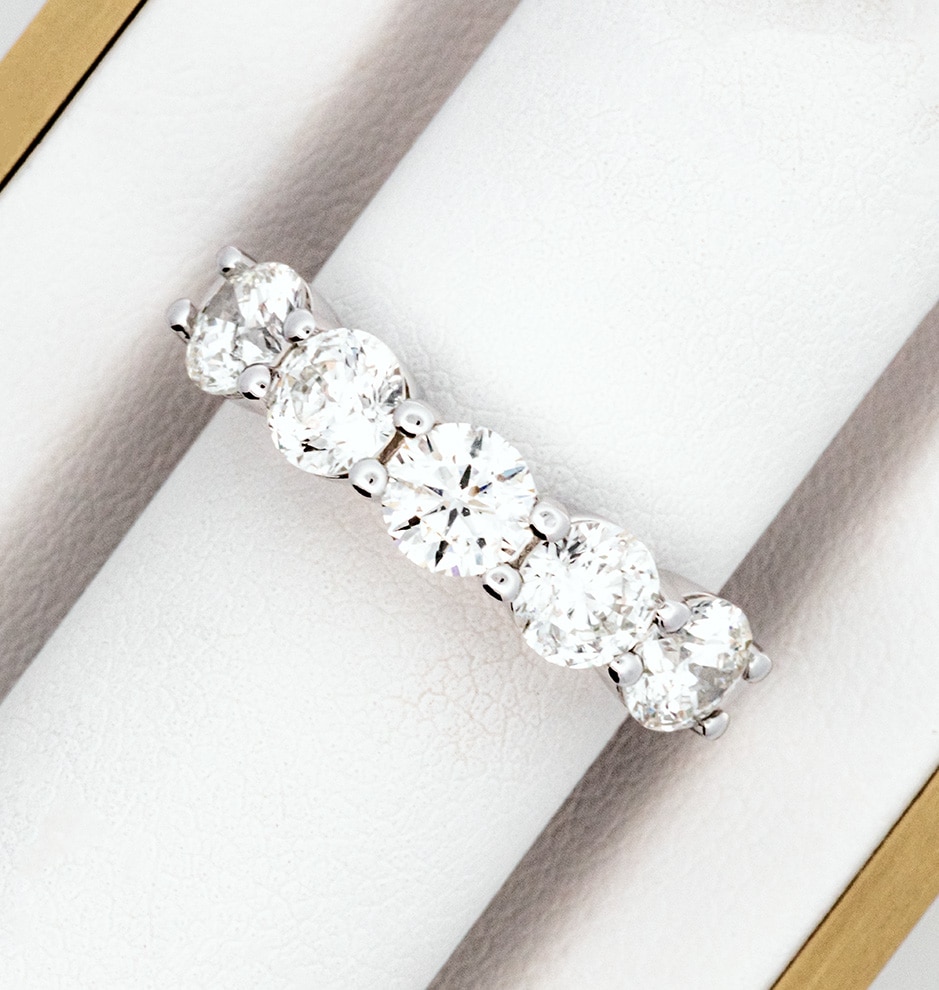 A white gold diamond ring in a box.