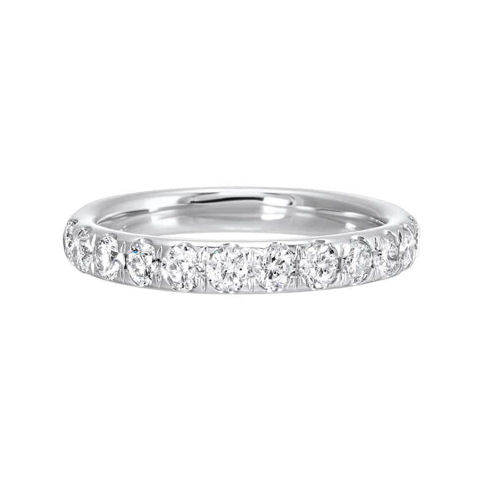 A white gold eternity band with round brilliant cut diamonds.