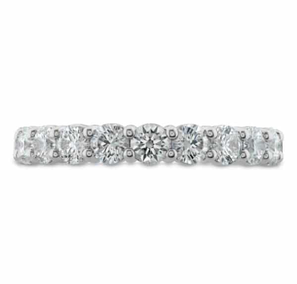 A white gold diamond band with round stones.