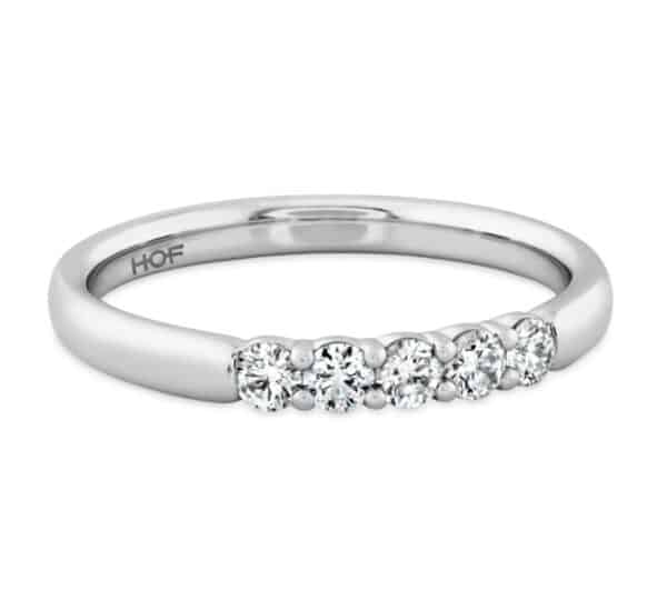A white gold band with four round diamonds.