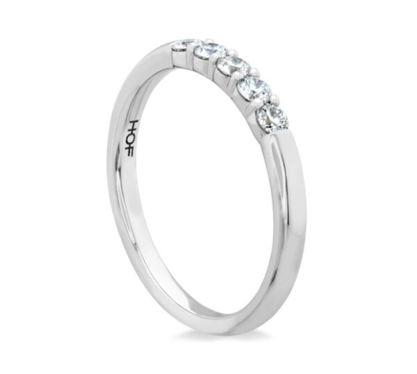 A white gold ring with four round diamonds.