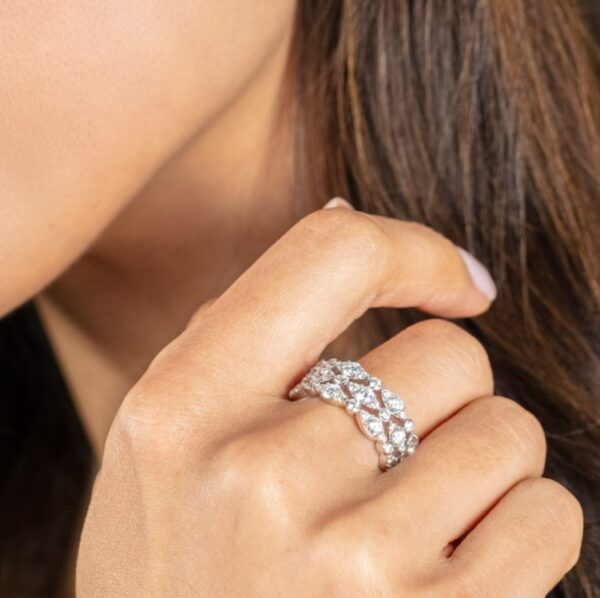 A woman wearing a diamond ring.