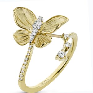 A yellow gold butterfly ring with diamonds.