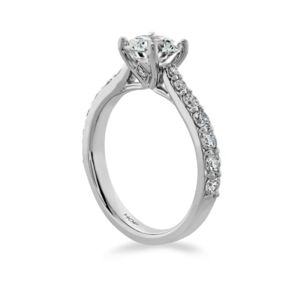 A white gold engagement ring with a round brilliant cut diamond.