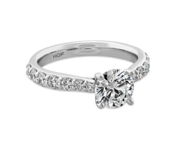 A white gold engagement ring with a round diamond in the center.