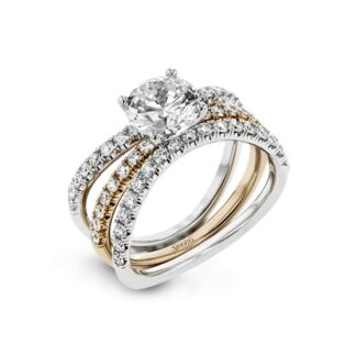 A diamond engagement ring set in two tone gold and white gold.