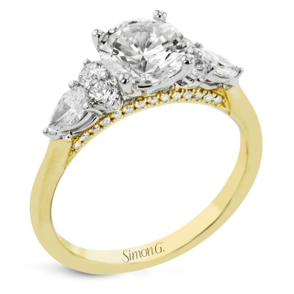 A yellow gold engagement ring with three stones.