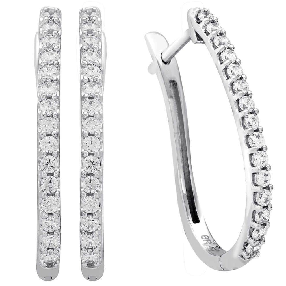 A pair of white gold hoop earrings with diamonds.