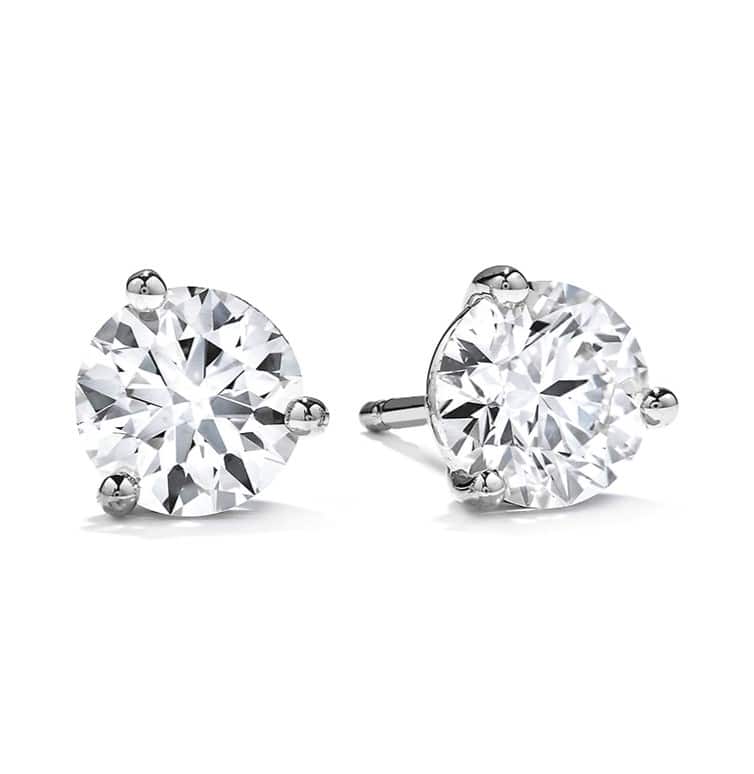A pair of diamond stud earrings in white gold.