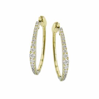 A pair of yellow gold hoop earrings with diamonds.