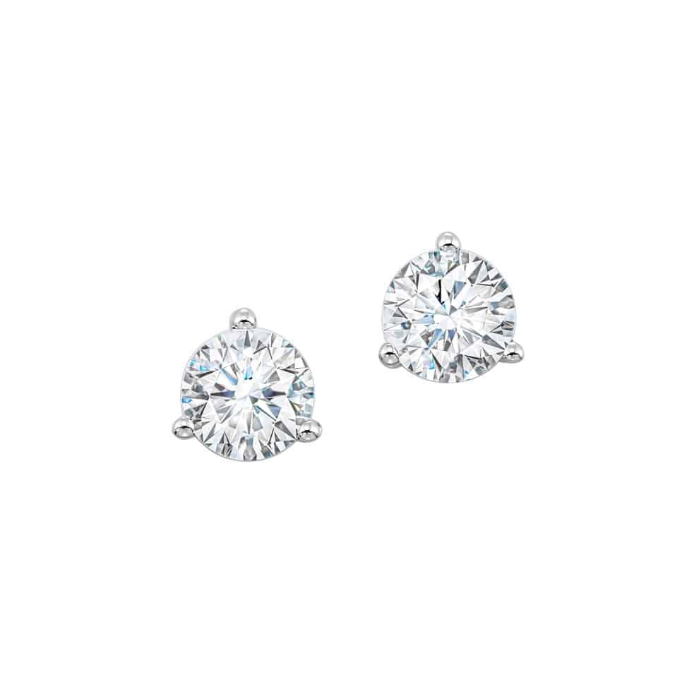A pair of diamond stud earrings on a white background.