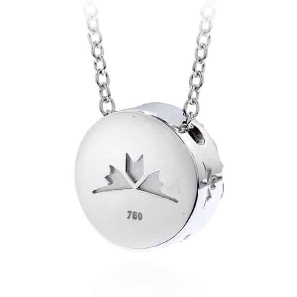 A silver necklace with an image of a canadian flag on it.