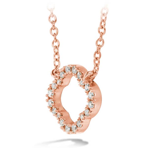 A rose gold necklace with diamonds in the center.