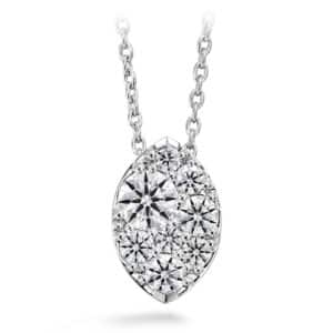 A white gold pendant with a cluster of diamonds.