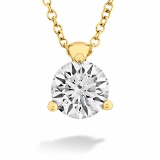 A yellow gold pendant with a round brilliant cut diamond.