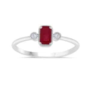 An emerald cut ruby and diamond ring.