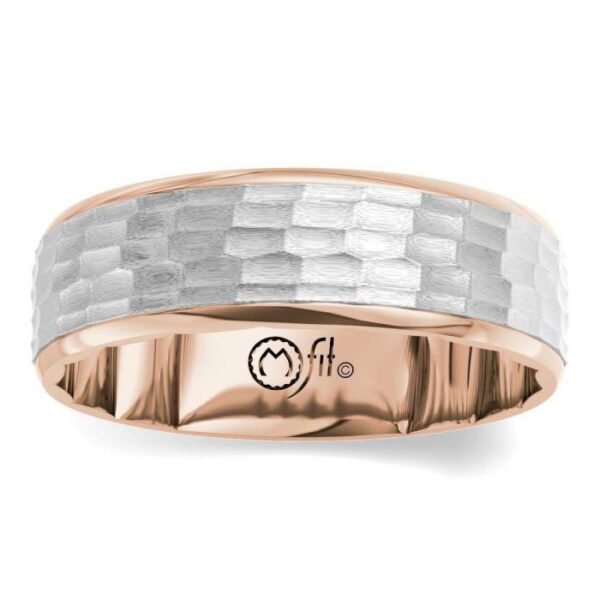 A men's wedding band in rose gold and white gold.