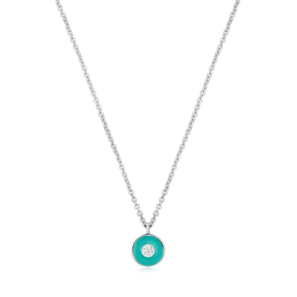 A necklace with a turquoise stone and a silver chain.