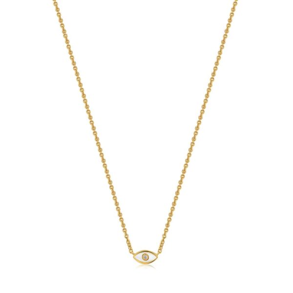 A gold necklace with an evil eye on it.