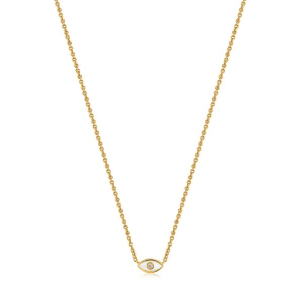 A gold necklace with an evil eye on it.