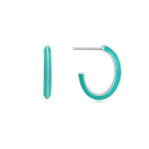 A pair of turquoise hoop earrings on a white background.