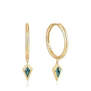 A pair of gold hoop earrings with an emerald stone.