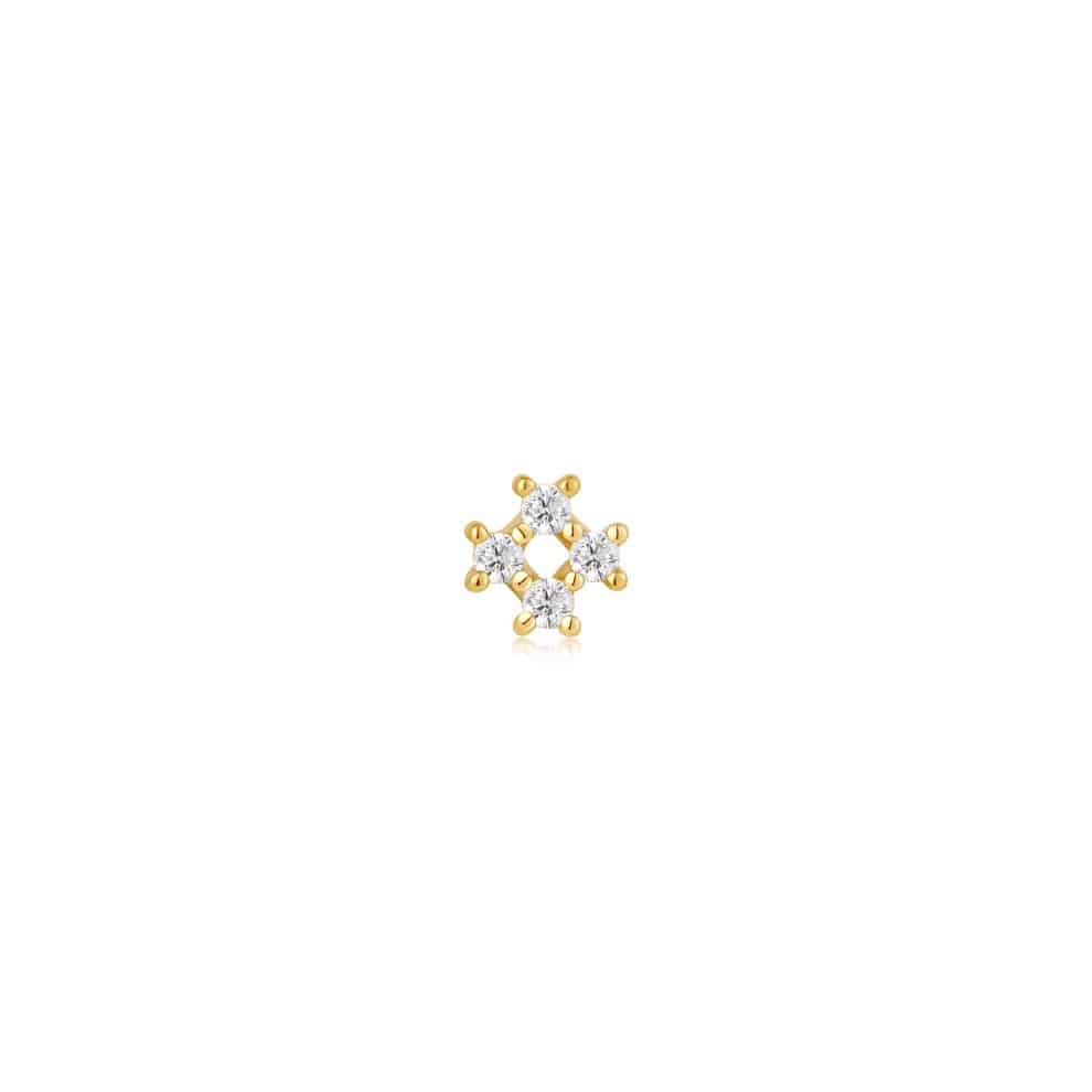 A small diamond stud earring in yellow gold.