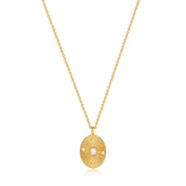 A yellow gold necklace with an oval pendant and diamonds.