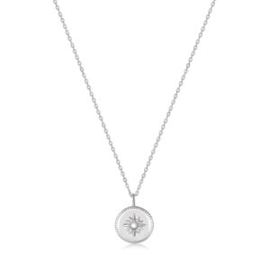 A silver necklace with a diamond pendant on it.