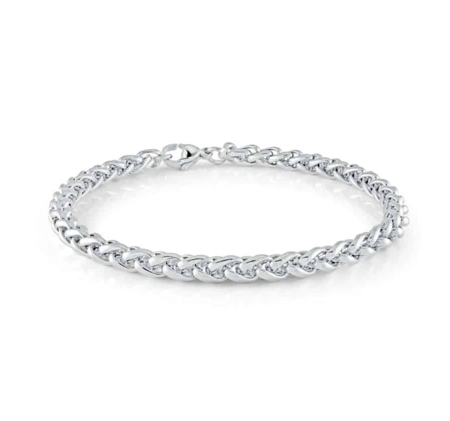 A white gold chain bracelet with diamonds.