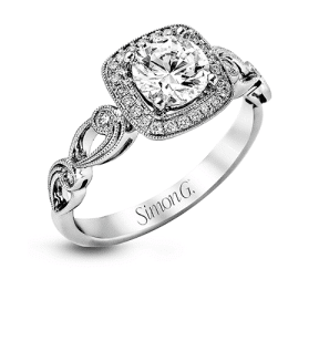 A diamond engagement ring with a halo and diamonds.