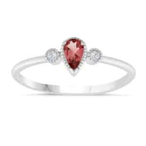 A sterling silver ring with a pear shaped garnet and diamonds.