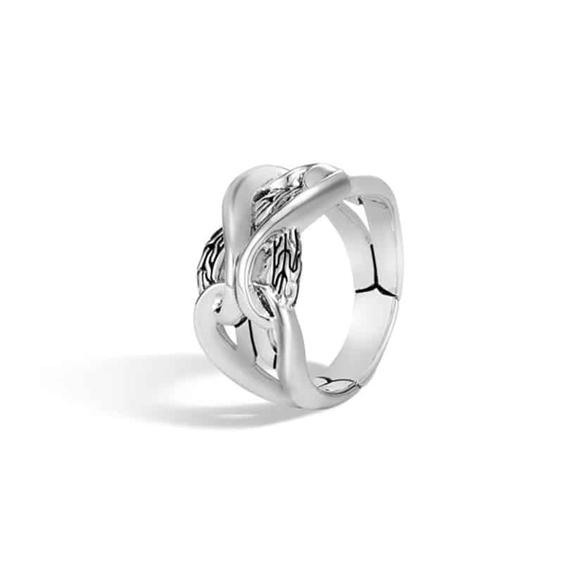 A sterling silver ring with an intricate design.